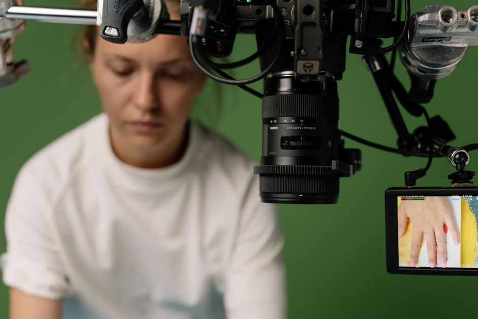 Behind the scenes of a studio shoot with a focus on video equipment and setup.