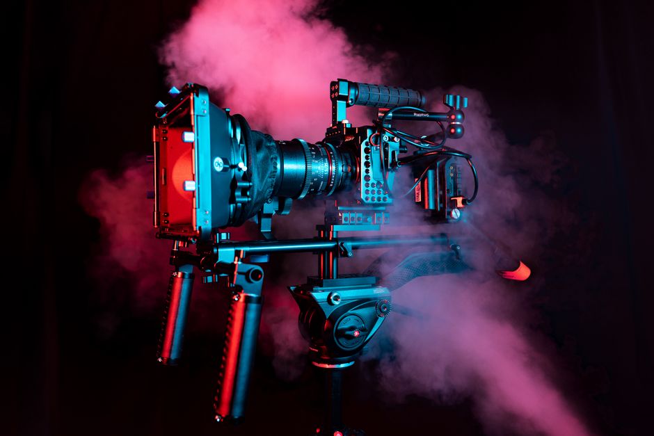 Professional camera rig with red and pink smoke, creating a dynamic visual impact.