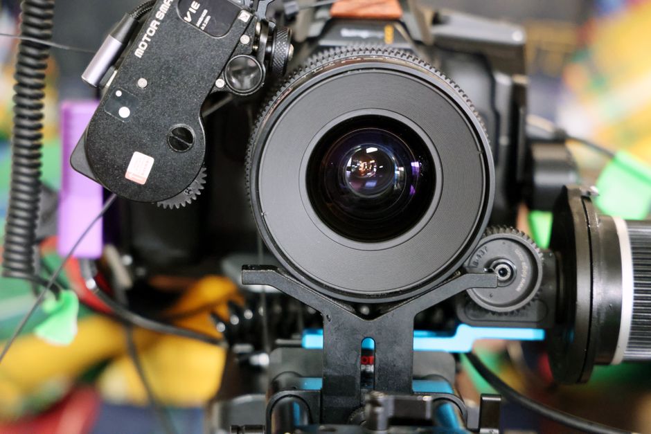 Detailed view of a professional camera with lens and equipment.
