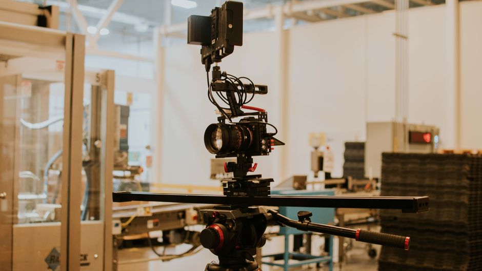 Detailed view of a camera rig set up for professional filming inside a studio setting.