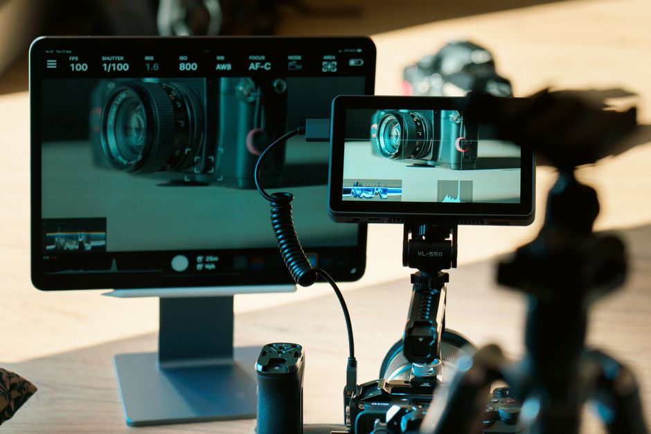 Camera and monitor setup for video production and photography editing in a studio.