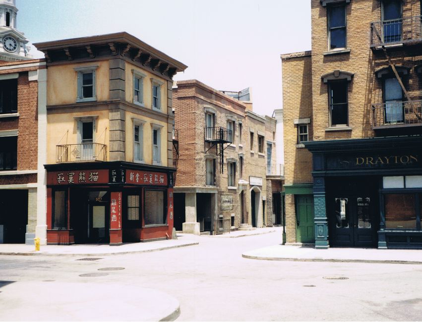 Street view of vintage brick structures on a nostalgic film set.