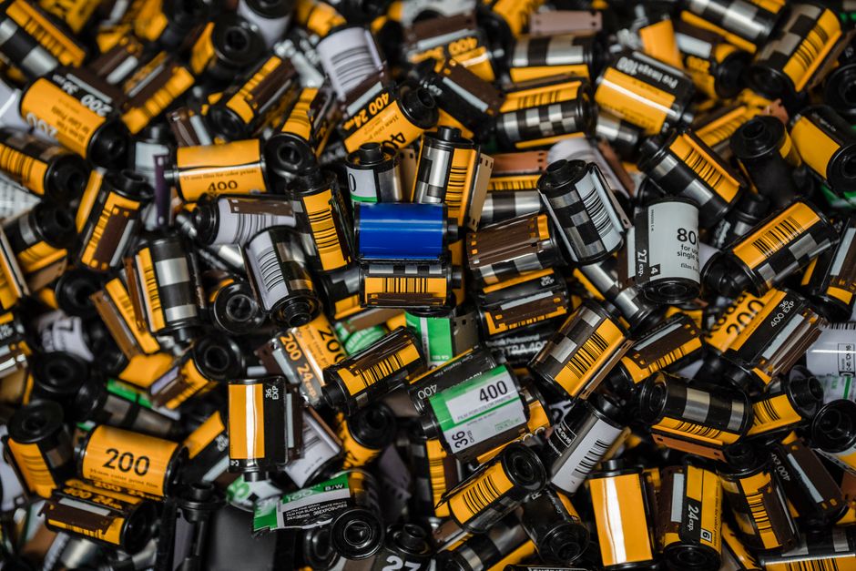 Explore a vast collection of colorful vintage film rolls captured in a detailed close-up.