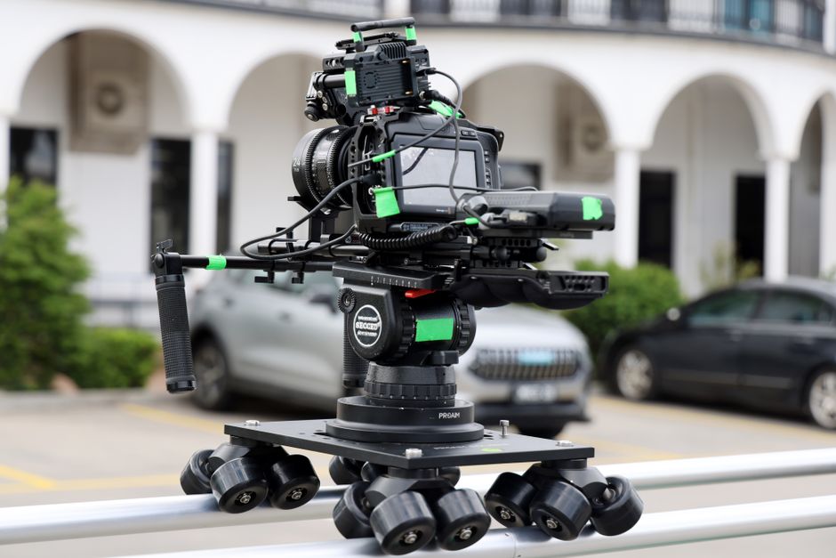 High-quality camera rig on a dolly track set outdoors for filming in Melbourne, Australia.