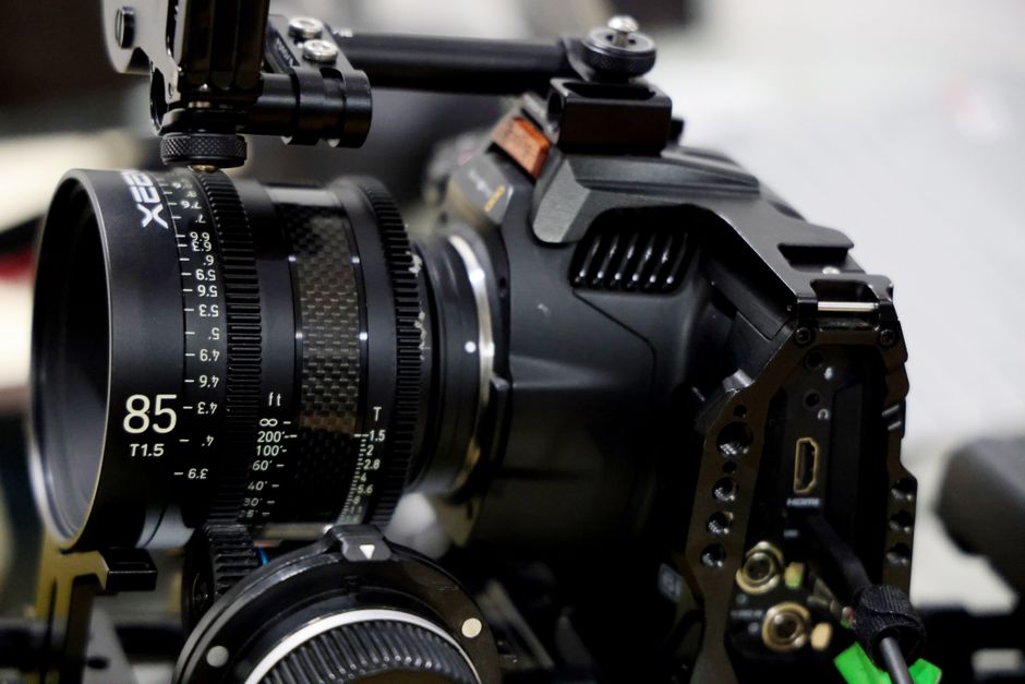 Close-up of a professional cinema camera with an 85mm lens setup, ideal for filmmaking.