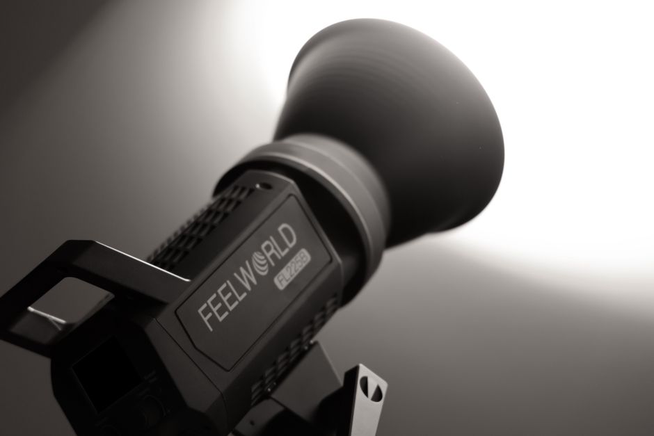 Close-up of professional studio light Feelworld FL225B with lens flare effect.