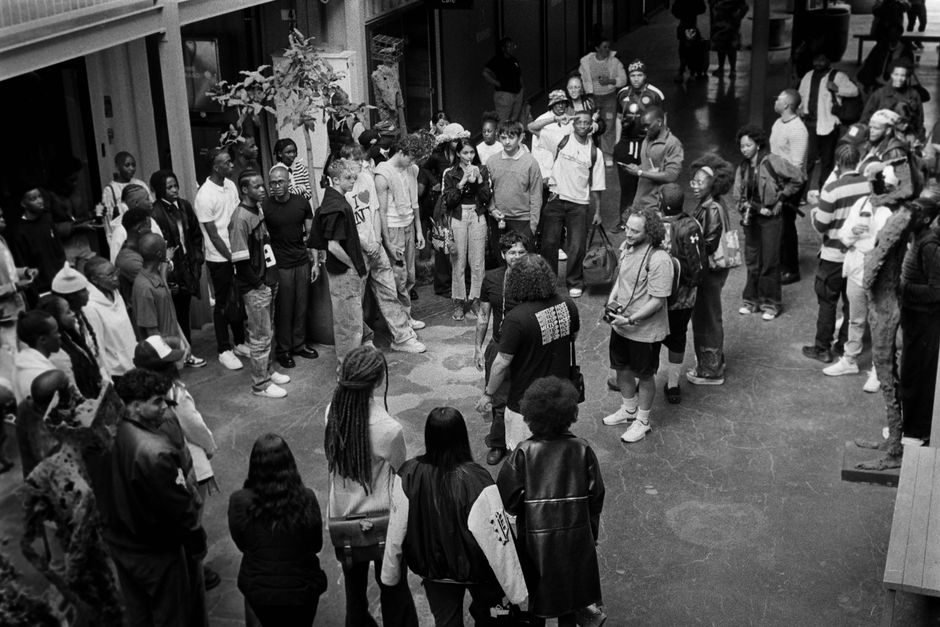 A diverse group of people gathered indoors for an event in Johannesburg, South Africa.