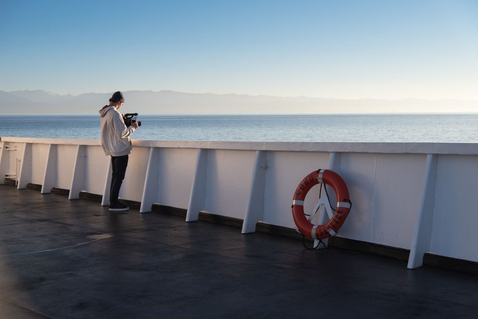Filmmaker captures a serene maritime view on a ferry deck in Canada.