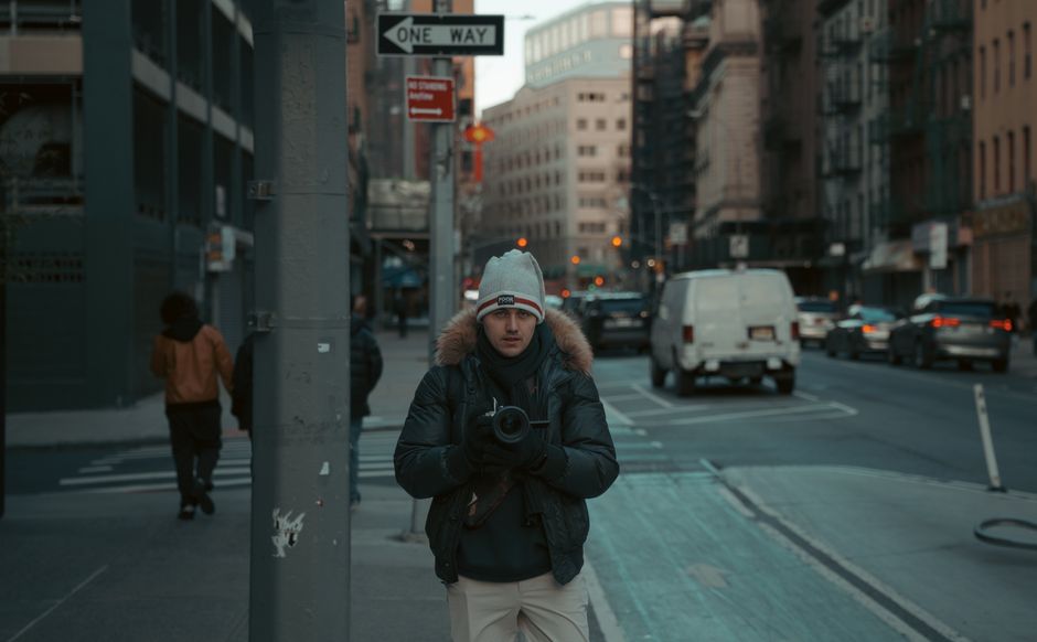 Capturing a candid street scene in downtown New York City during twilight.