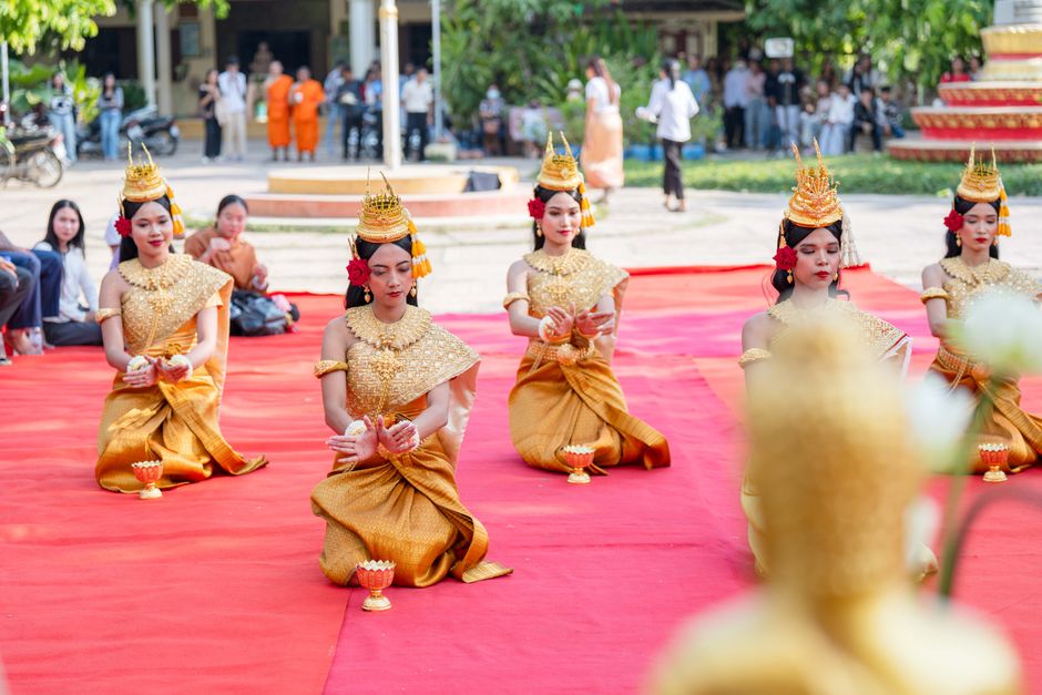 Cambodian dancers performing a traditional ceremony in Battambang Province, showcasing vibrant cultural attire.