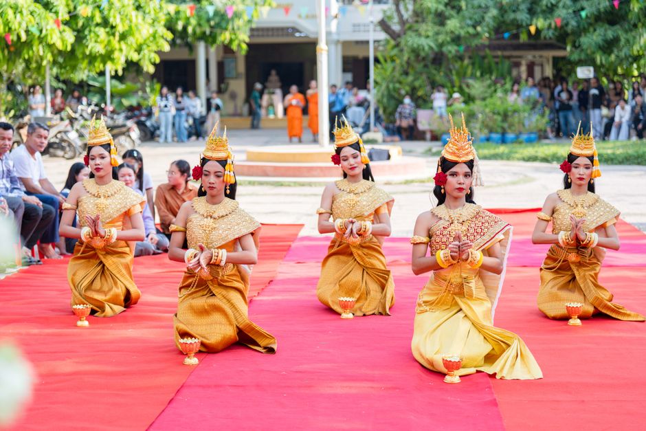 Five women in traditional Cambodian attire perform a cultural dance in Battambang Province.