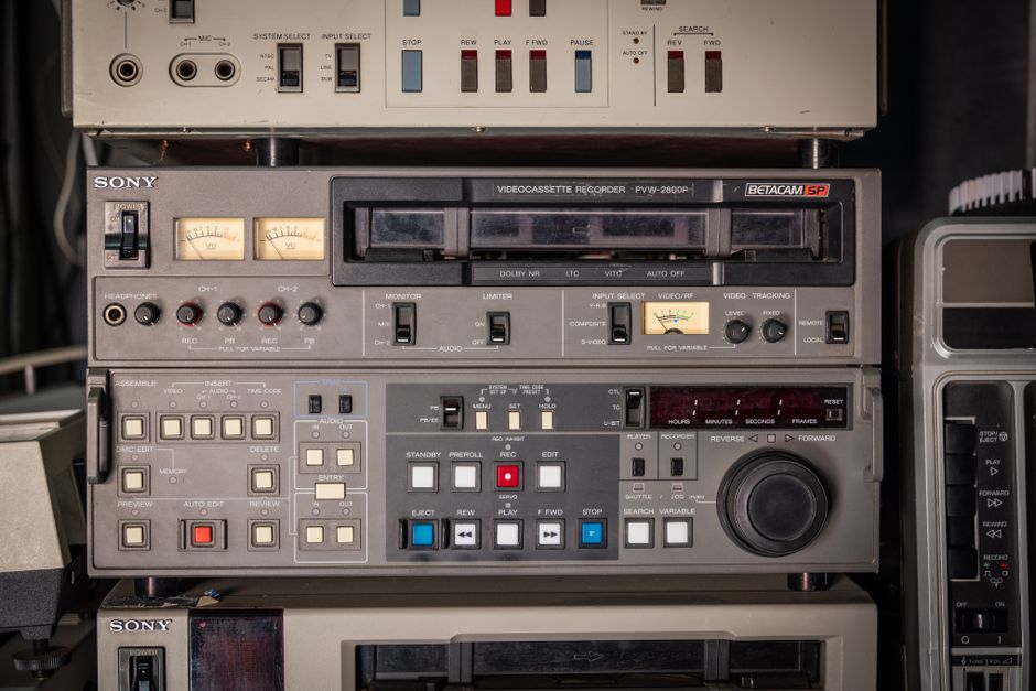 Close-up of a vintage Sony Betacam SP videocassette recorder showing controls and dials.