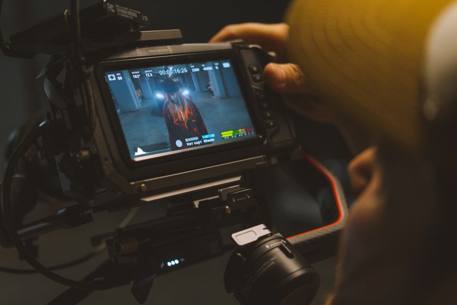 Capturing a cinematic scene with professional video camera equipment indoors.