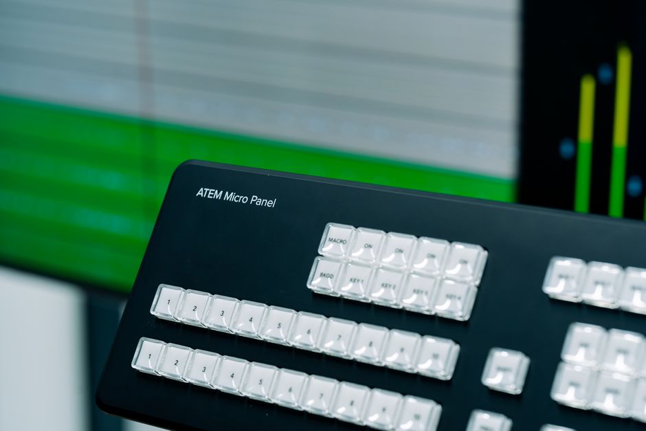 Detailed view of an ATEM Micro Panel with blurred background, ideal for tech and broadcasting themes.