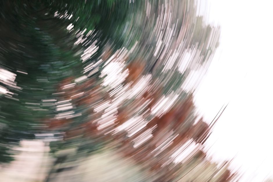 Abstract image capturing dynamic motion with a swirling blur effect, creating a sense of movement.