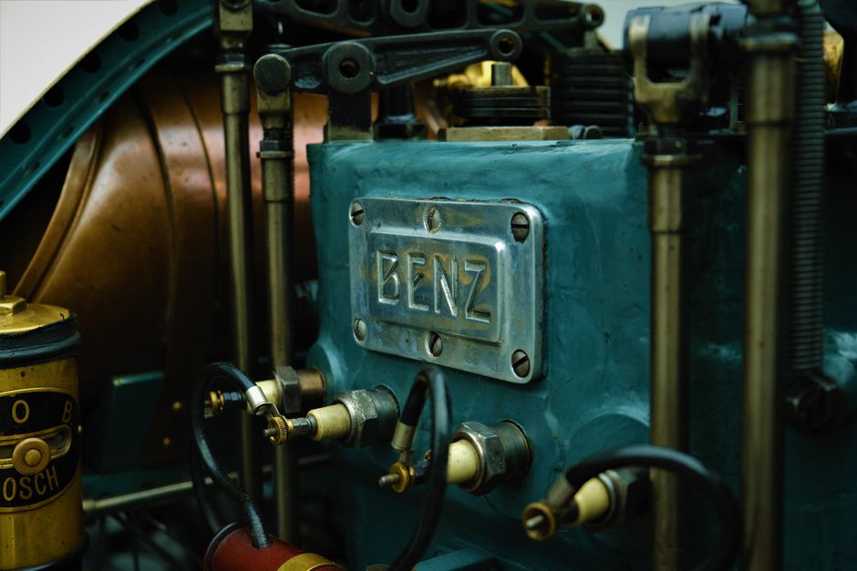 Detailed view of a vintage Benz engine showcasing intricate mechanical parts and retro design.
