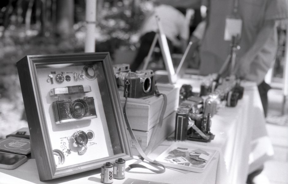 Display of various vintage cameras and analogue film at an outdoor exhibit in Taipei, Taiwan.