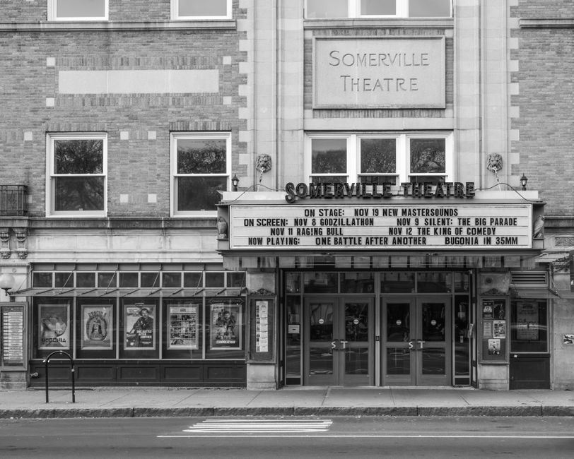Front view of Somerville Theatre in Massachusetts with event marquee, black and white photo.