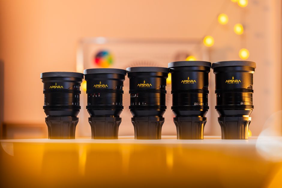 A set of five Apsara branded camera lenses on a stylishly lit table.