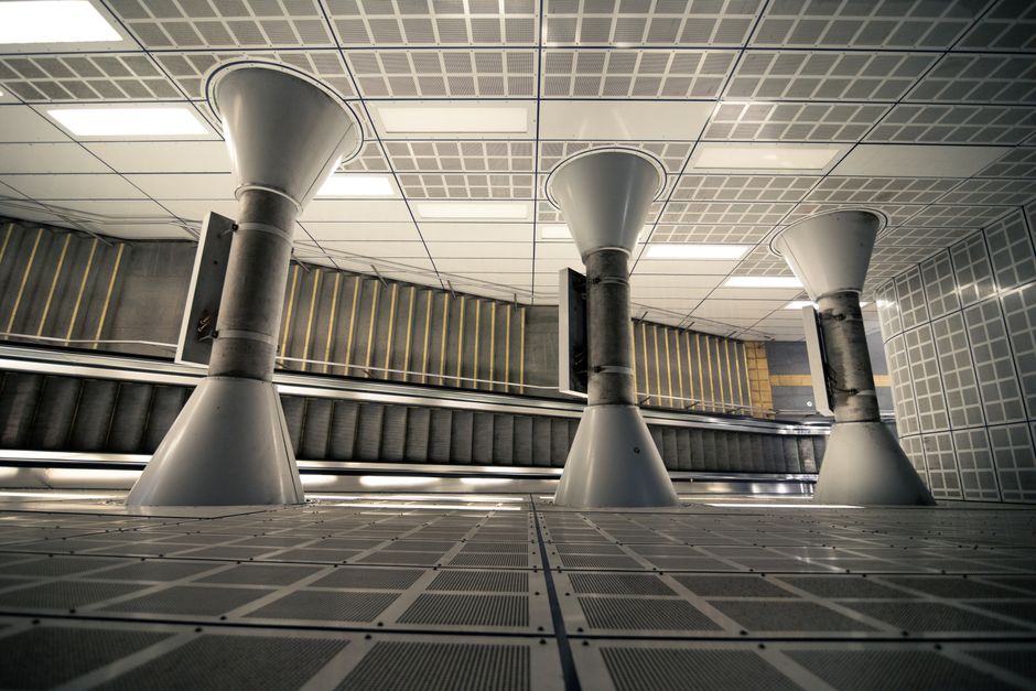 Futuristic interior of a modern building with striking architecture and escalators.