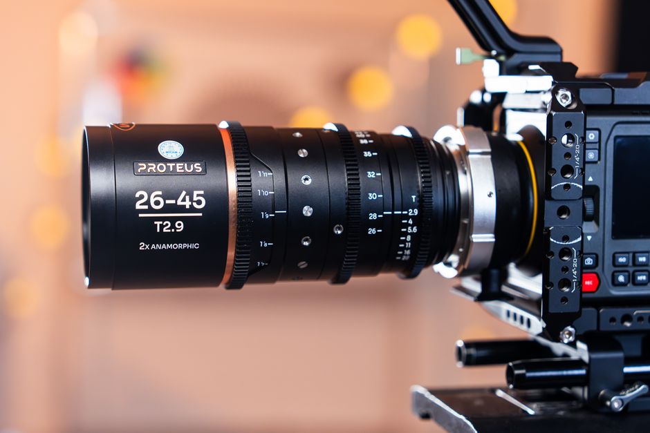 Close-up shot of a 26-45 T2.9 anamorphic lens on a professional camera rig indoors.